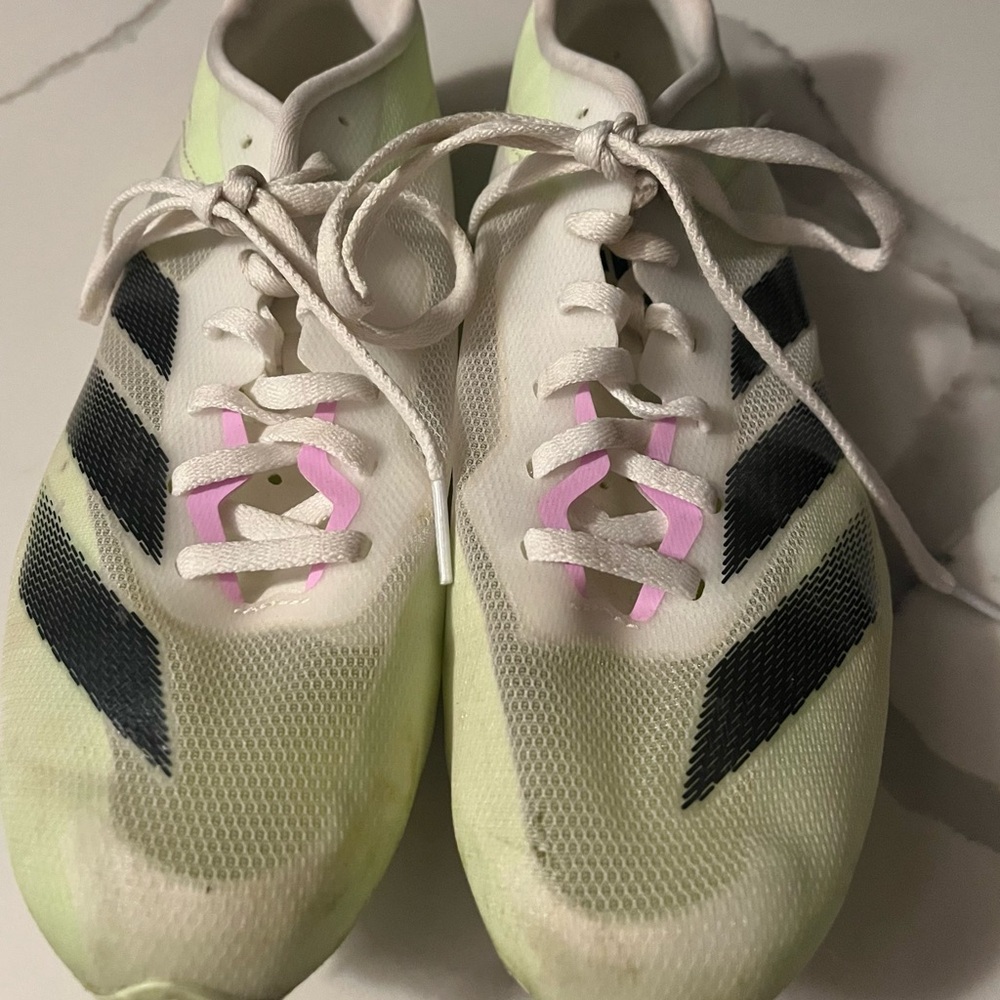 White, lime and Black Adidas Distancestar track & field spikes with Pink Accent.